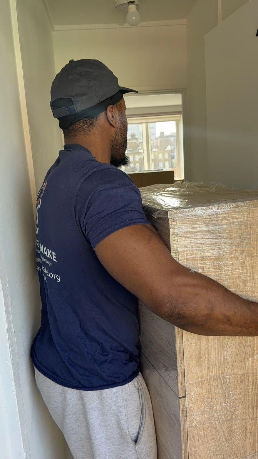 Team delivering furniture to a social housing property